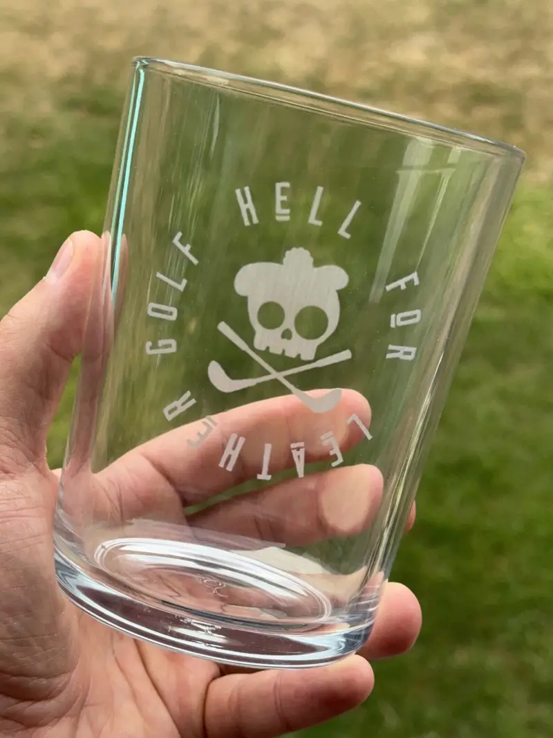 A bodega pint engraved with a company logo