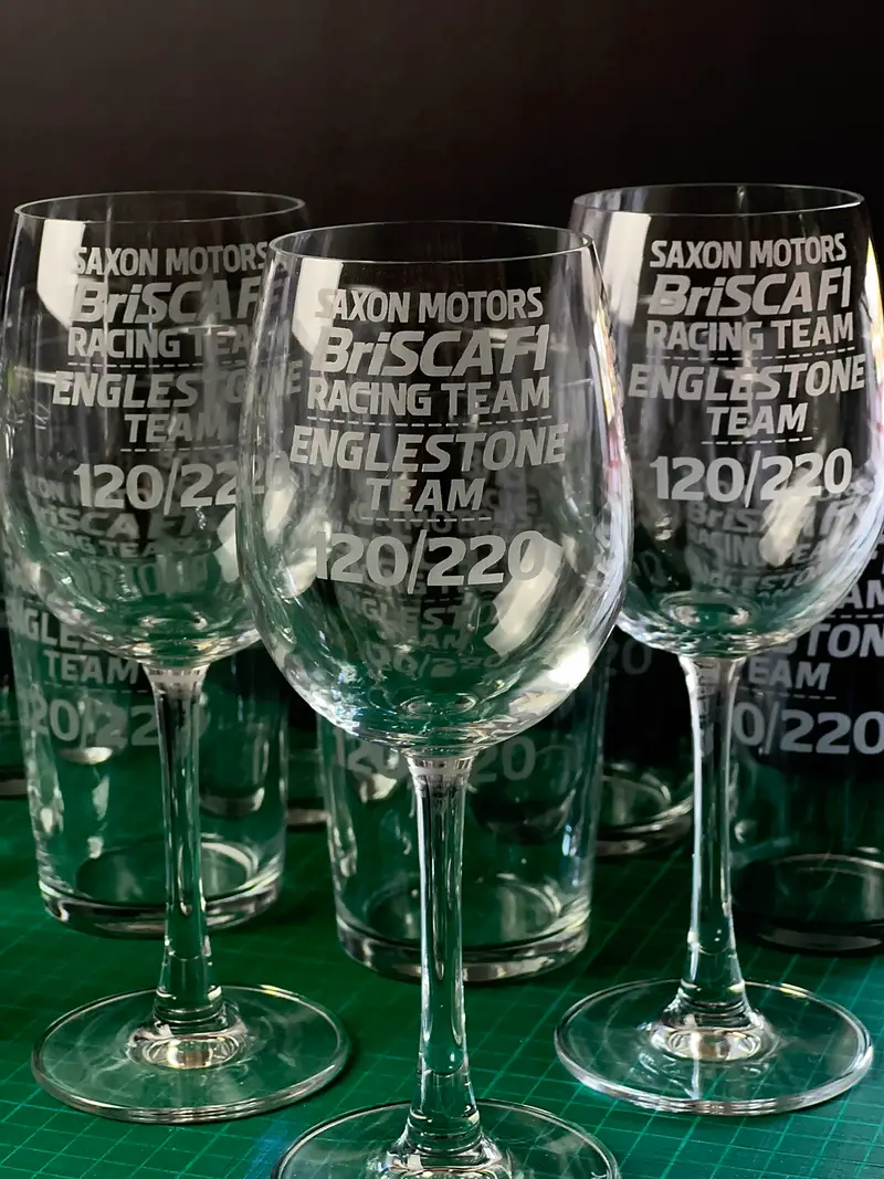 Wine glasses engraved with a motorsport club emblem