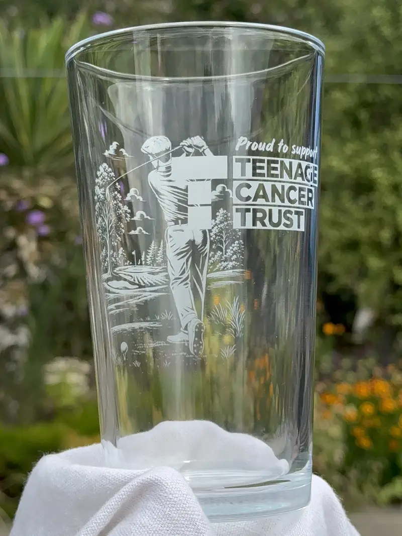 Two engraved glasses made for a charity event