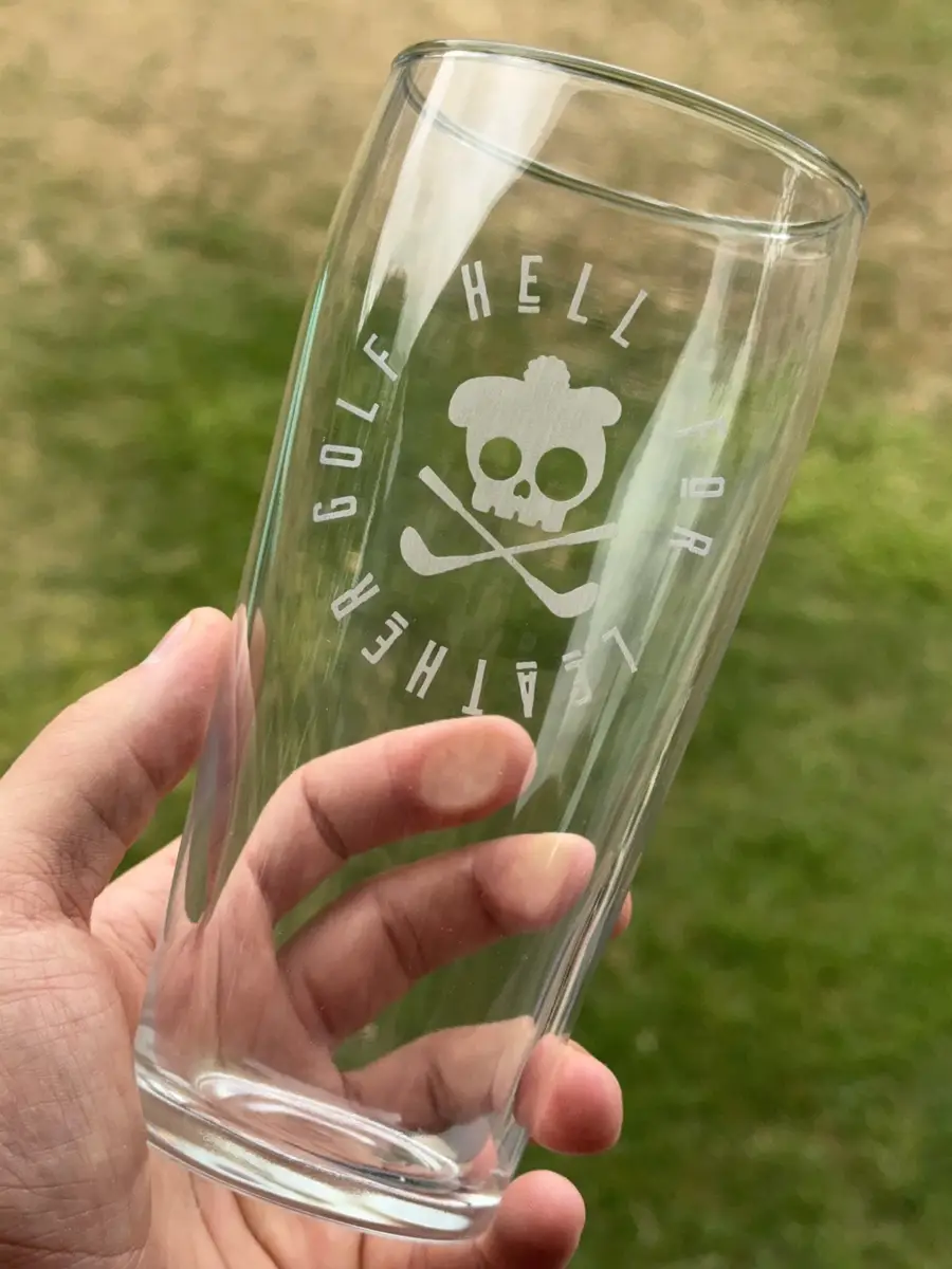 A Willi Becher pint engraved with a company logo